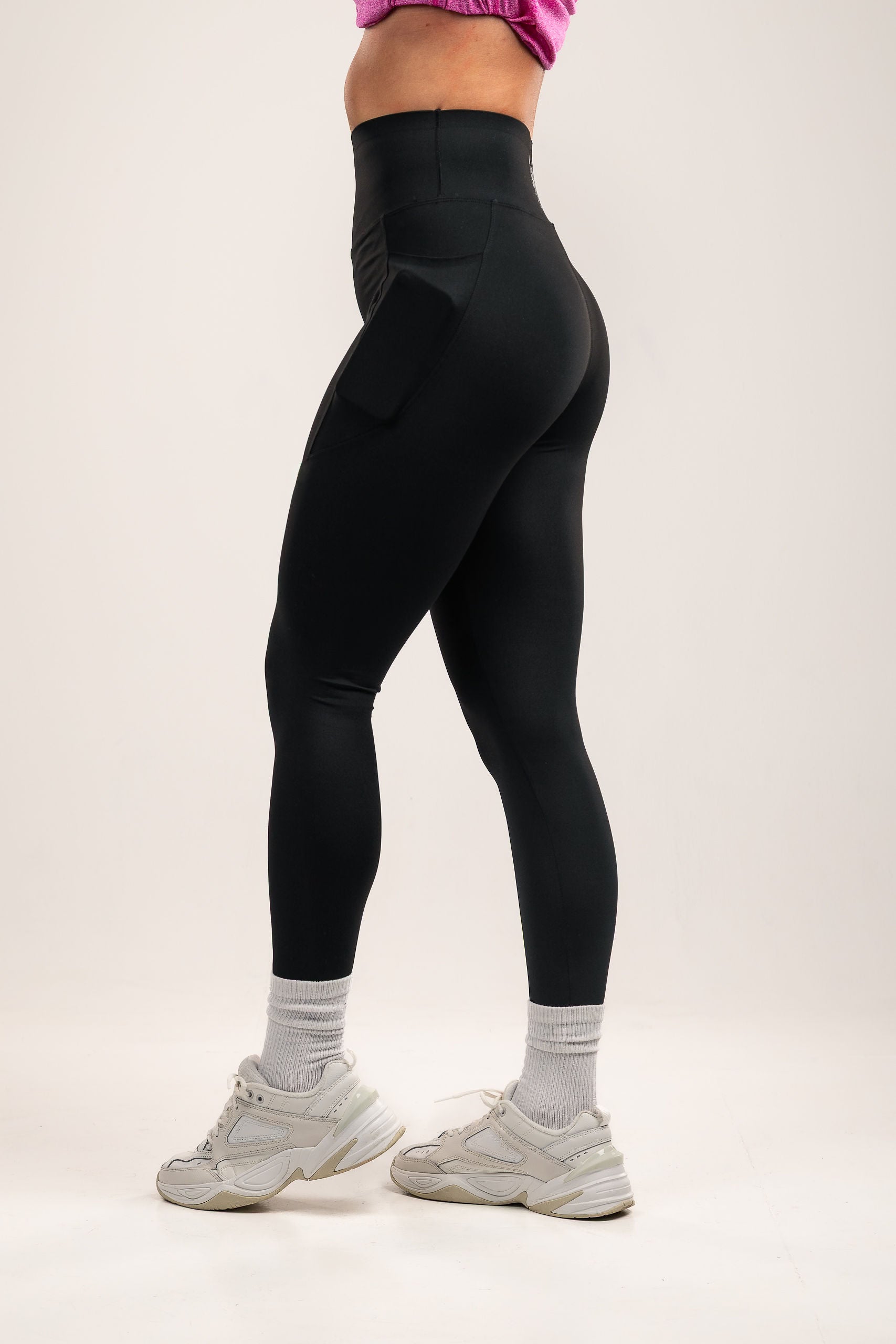 High-waisted Black leggings with deep side pocket features