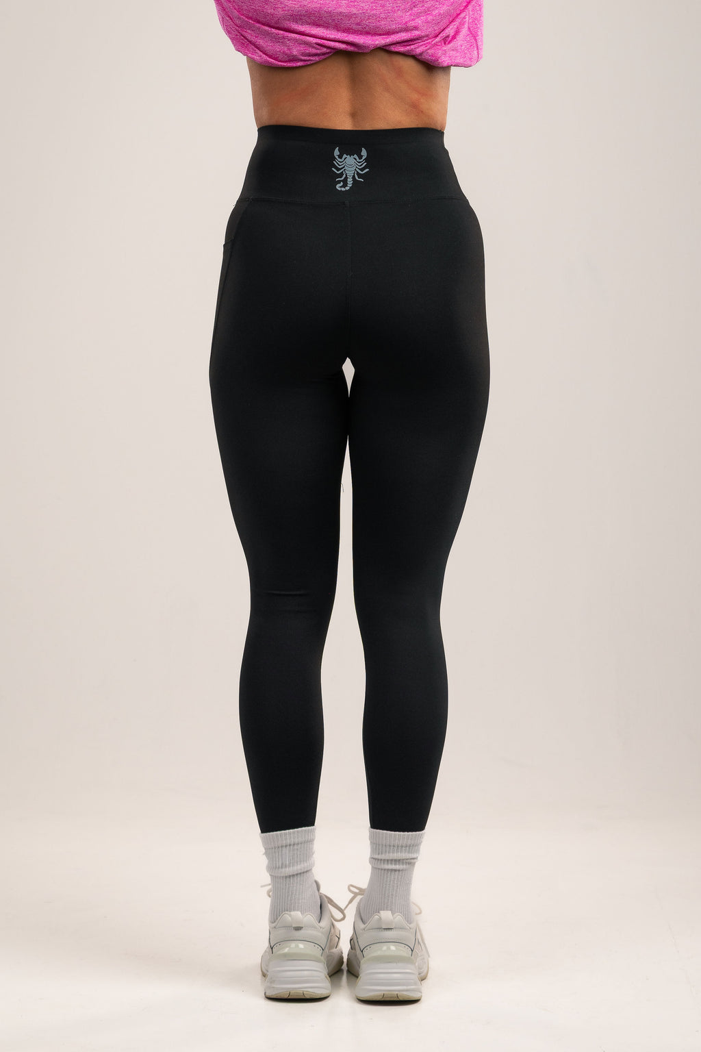 High-waisted Black leggings with deep side pocket features