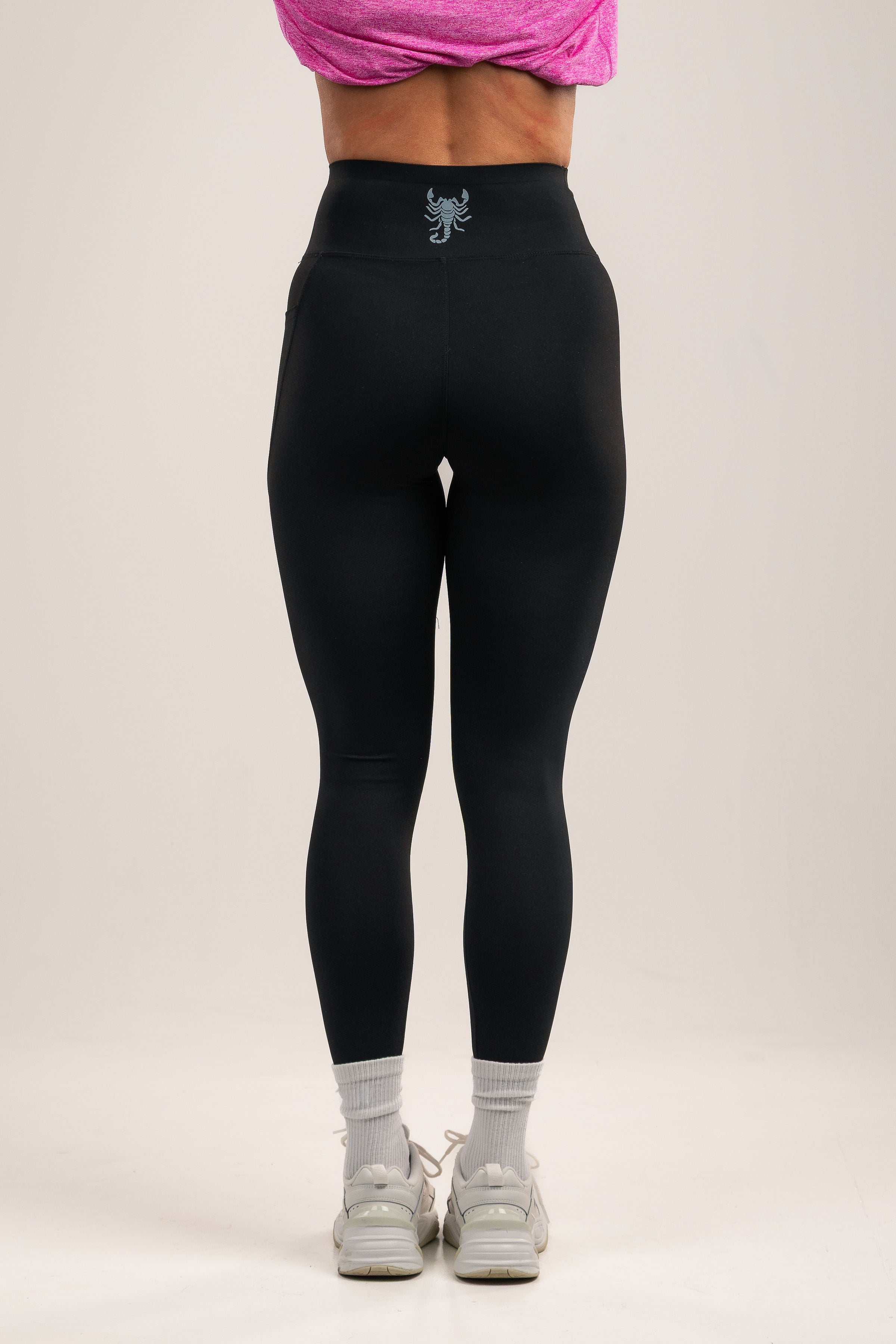 High-waisted Black leggings with deep side pocket features
